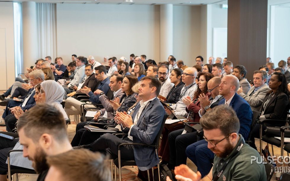 A seated audience applauding in a full conference room at a previous Excellence in Digital Banking summit